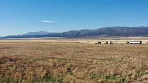 View of mountain background featuring rural landscape