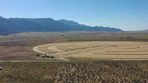 Aerial view of sparsely populated area featuring a mountain backdrop