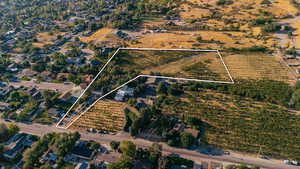 Aerial overview of property's location featuring rural landscape and property boundaries highlighted