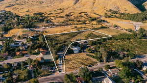 Aerial view of sparsely populated area with property boundaries highlighted and abundant farmland