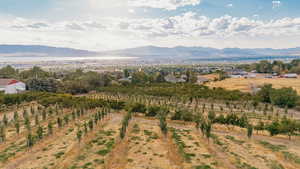 View of mountain backdrop with rural landscape