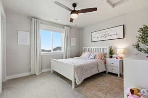 Bedroom featuring light colored carpet and ceiling fan