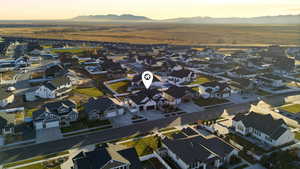 Aerial view at dusk of a residential view and a mountain view