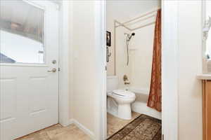 Bathroom with shower / tub combo and vanity