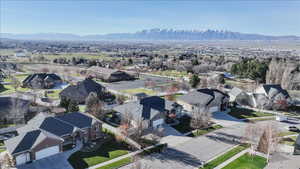 Aerial view of residential area featuring mountains