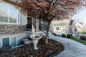 Property entrance featuring stone siding