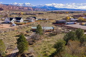 Aerial view of residential area featuring a mountainous background