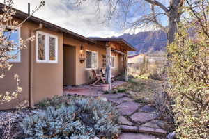 Exterior space featuring stucco siding and a mountain view