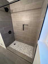 2697 - Full bath with a stall shower and tile patterned flooring