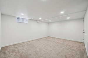 1597 - Finished below grade area featuring light colored carpet and recessed lighting