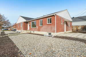 View of property exterior featuring brick siding