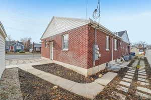 View of home's exterior featuring brick siding