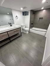 2697 - Bathroom with vanity, tub / shower combination, and recessed lighting