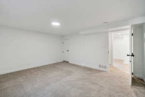 1597 - Spare room with light carpet and baseboards