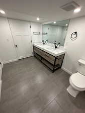 2697 - Bathroom with double vanity and baseboards