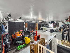 Finished Walls, Epoxy Floor, 240V Charging, Basement Entrance, Workbench, Man Door