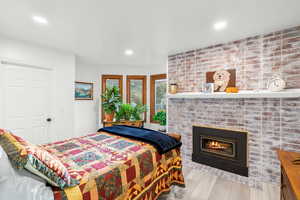 Main Level Bedroom with Gas Fireplace and Bay Windows