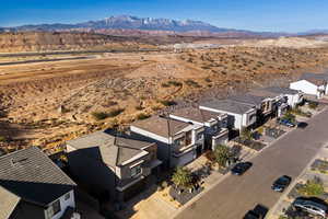 Aerial perspective of suburban area with a mountainous background