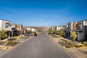 View of asphalt street with curbs and a residential view