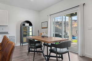Dining area featuring light wood-style floors and plenty of natural light