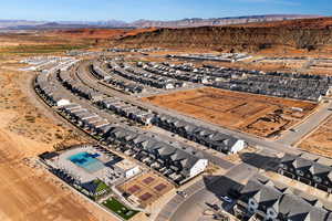 Aerial view of residential area featuring a mountainous background