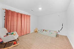 Playroom with carpet floors and baseboards