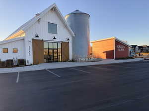 View of property with uncovered parking