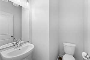 Bathroom featuring a sink and toilet