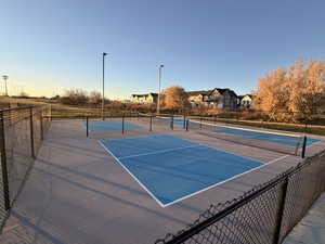 View of tennis court featuring community basketball court