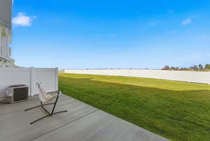 Fenced backyard with a patio area