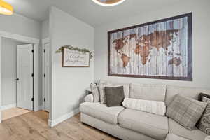 Living area featuring wood finished floors and baseboards