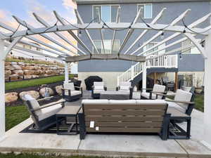 View of patio / terrace with an outdoor living space, a pergola, stairs, and grilling area