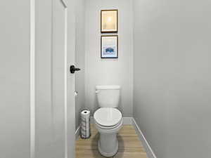 Bathroom featuring light wood-style floors and baseboards
