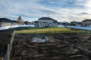 View of pasture facing back of house; pasture has a duck pond.