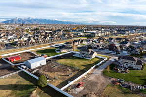 Aerial perspective of suburban area featuring a mountainous background