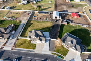 Aerial view of property's location featuring nearby suburban area