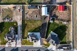 Aerial view of property and surrounding area with property parcel outlined