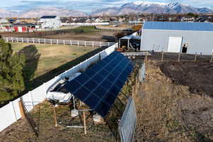 Drone / aerial view of a mountain backdrop and solar panels