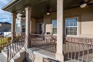 View of covered porch with ceiling fan