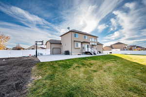 View of front of home with a fenced backyard, stucco siding, and a gate