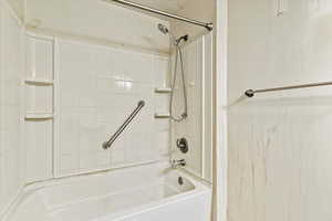 Bathroom with shower / washtub combination