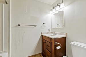 Bathroom featuring vanity and toilet