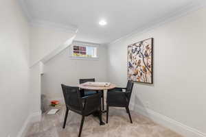 Dining room with carpet, crown molding, and recessed lighting