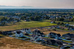 Aerial view of residential area featuring a mountainous background