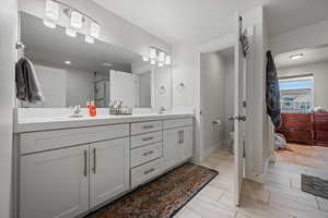 Bathroom with double vanity and a stall shower