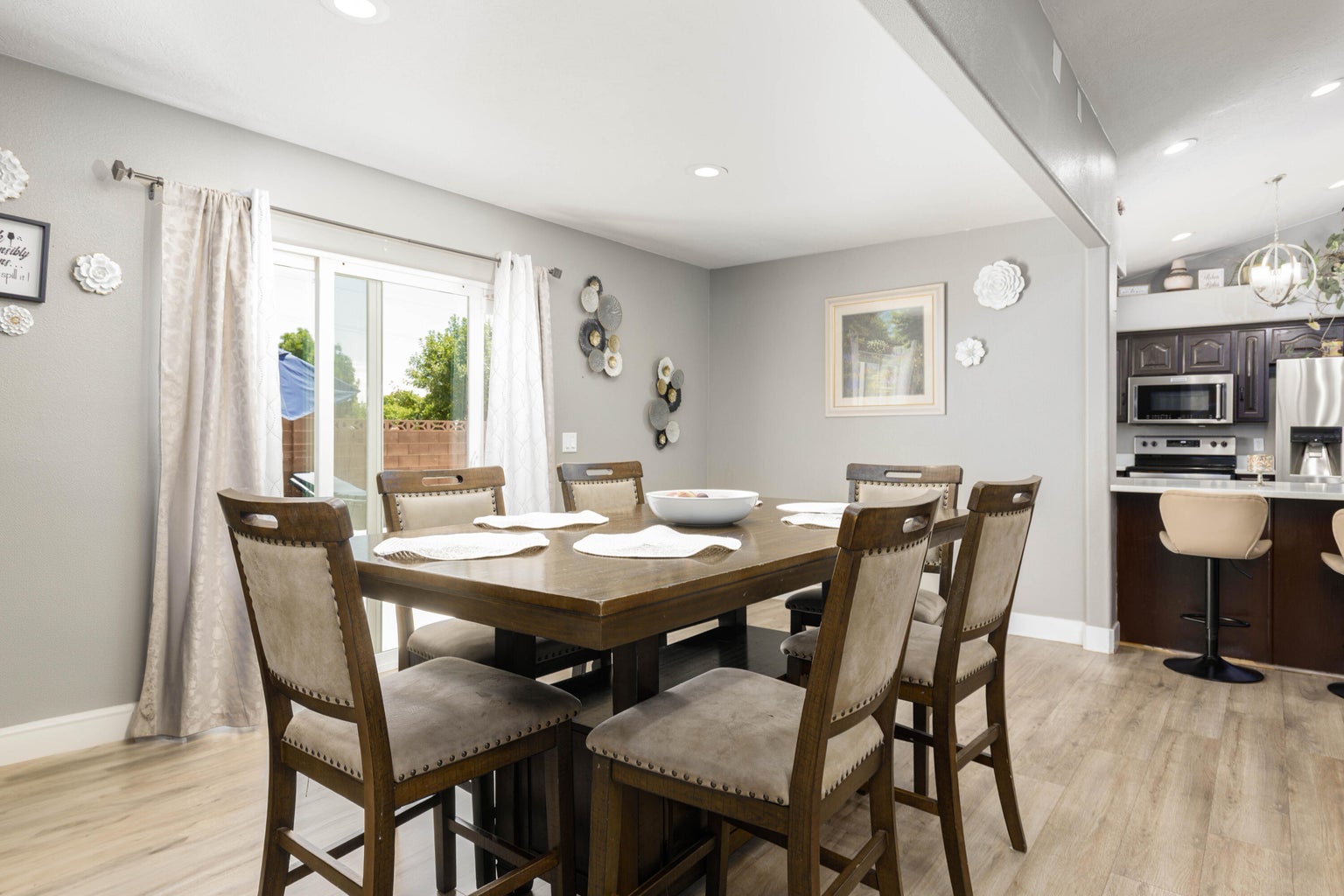 Dining space with light wood-style floors, recessed lighting, and lofted ceiling