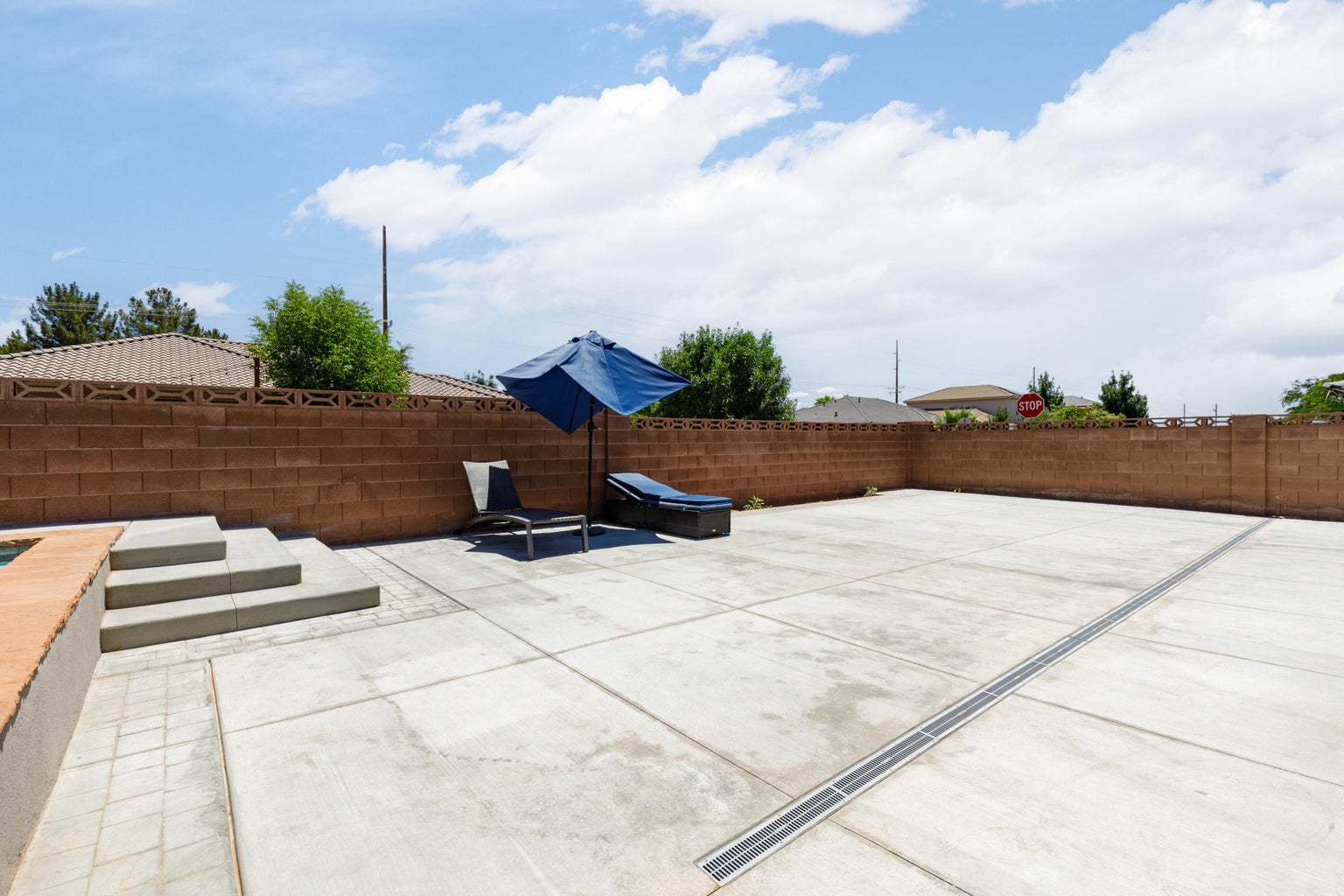 Fenced backyard featuring a patio