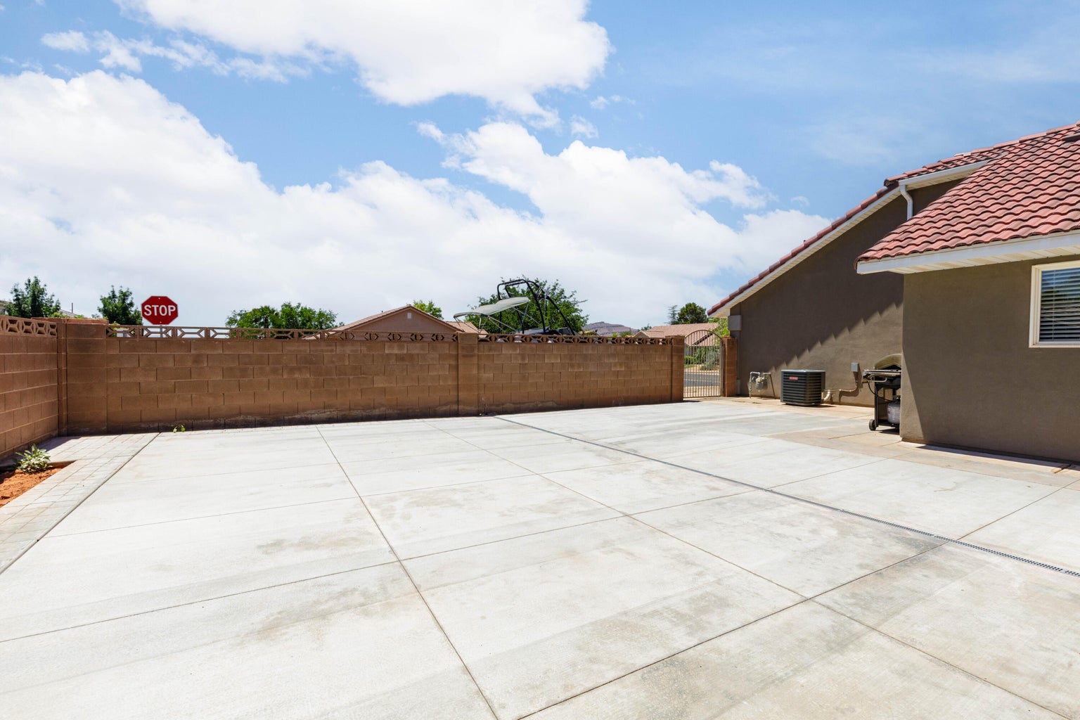 Fenced backyard featuring a patio area