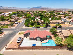 Aerial perspective of suburban area with a mountain backdrop