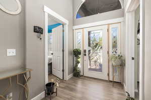 Entryway featuring light wood-style floors and baseboards
